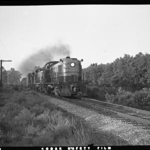 A trio of RS-3s lead by #524 heading a freight train on single track line A trio of RS-3s lead by #524 heading a freight train on single track line