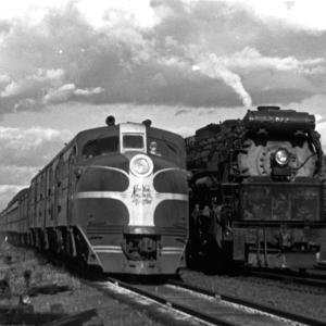 DL-109 on Train 23 overtakes R-3 on freight at Saw Pit Crossing, Guilford, CT. The freight, holding on Track 1, is likely M-7 from Worcester.