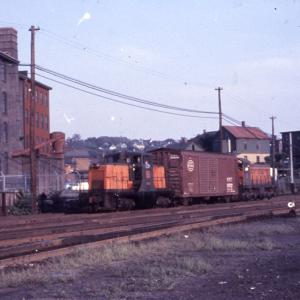 Distant photo of GE 44-tonner #0807 at Providence eastbound hump yard, Providence, RI. Also in photo is unidentified S-1, NYC boxcar is between 0807 and the S-1 Distant photo of GE 44-tonner #0807 at Providence eastbound hump yard, Providence, RI. Also in photo is unidentified S-1, NYC boxcar is between 0807 and the S-1