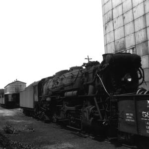 R-3-a  Class 4-8-2 #3555 outside the firing shed on 7/2/1949.  The sandblasting shed - nearly identical - can be seen in the distance