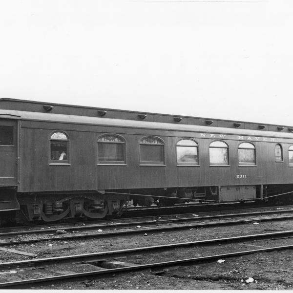 Wooden diner with steel ends and truss rods.