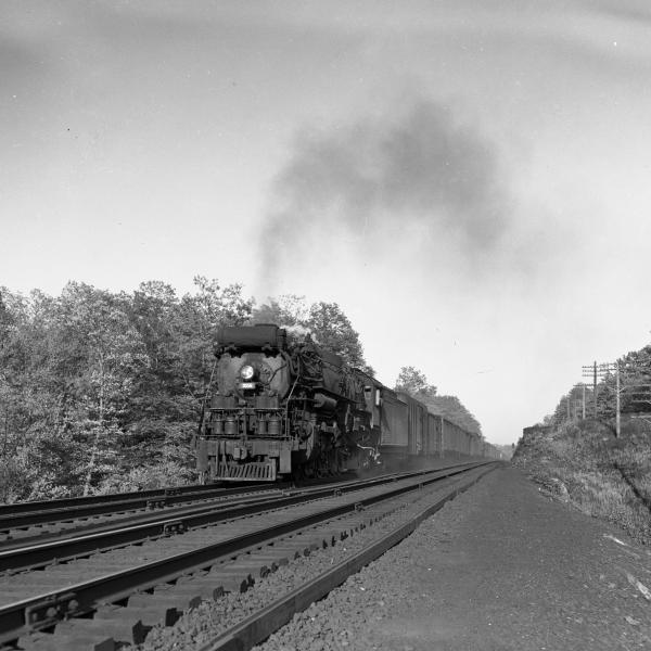 NH #1000 with southbound passenger train above Seymour